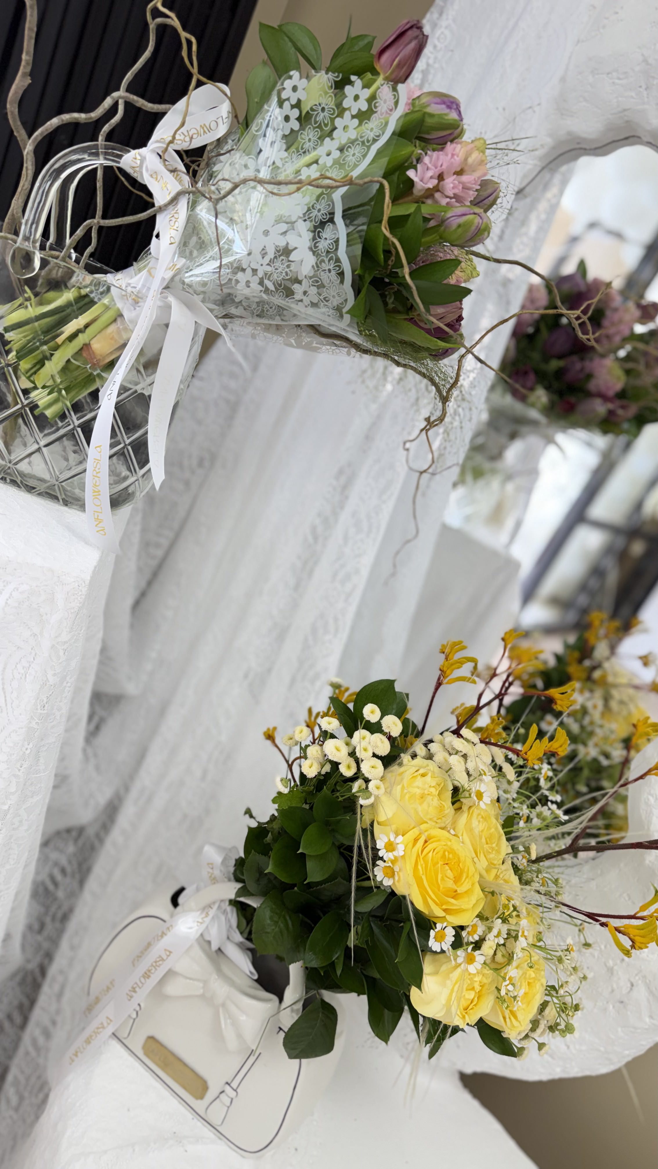 Yellow roses with purse vase — view 1